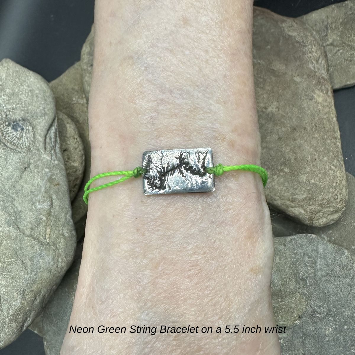 A handcrafted silver bracelet showing the topographic contours of the Grand Canyon – front view plain bracelet