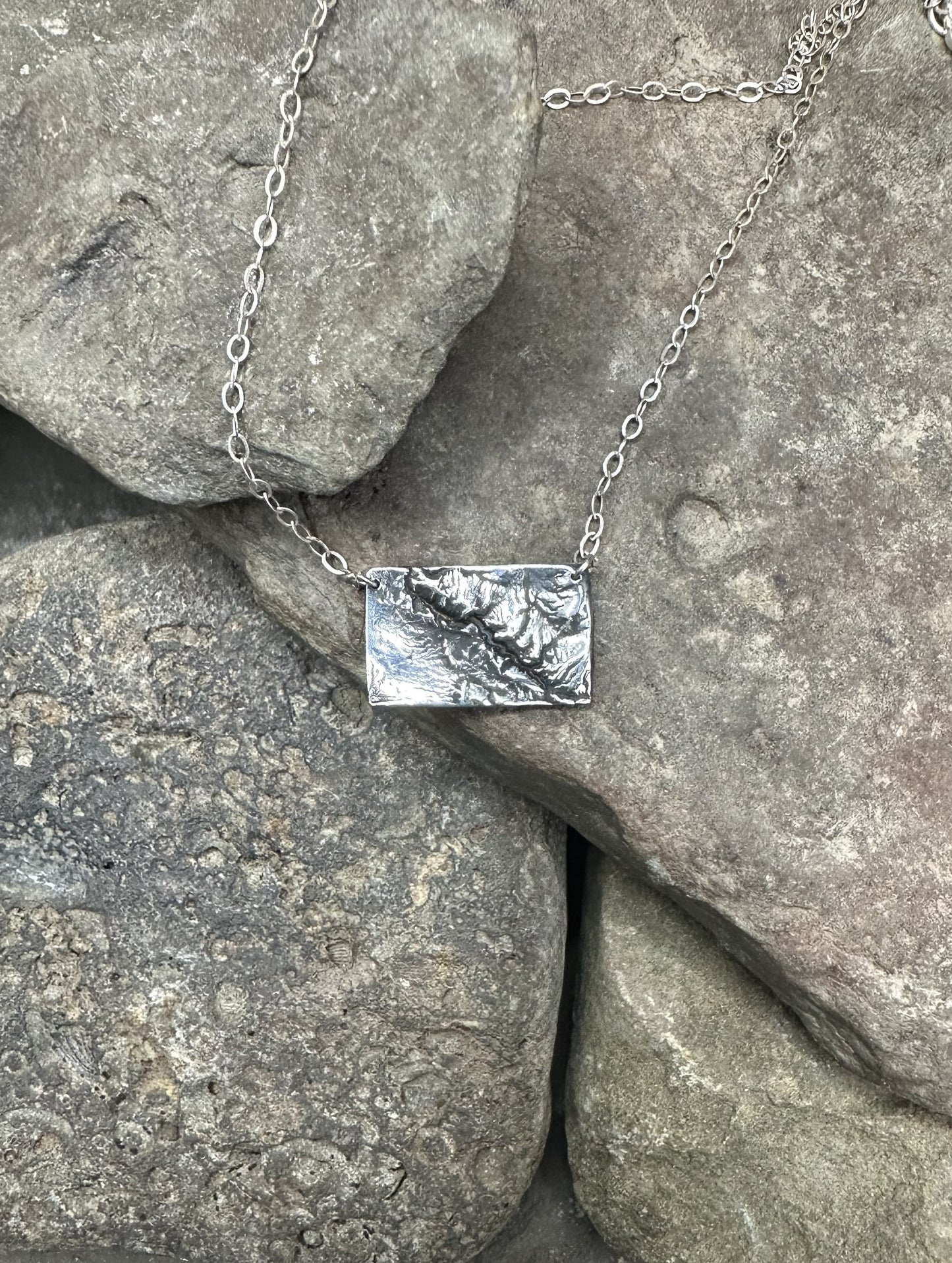 The Black Canyon of the Gunnison River necklace in silver.