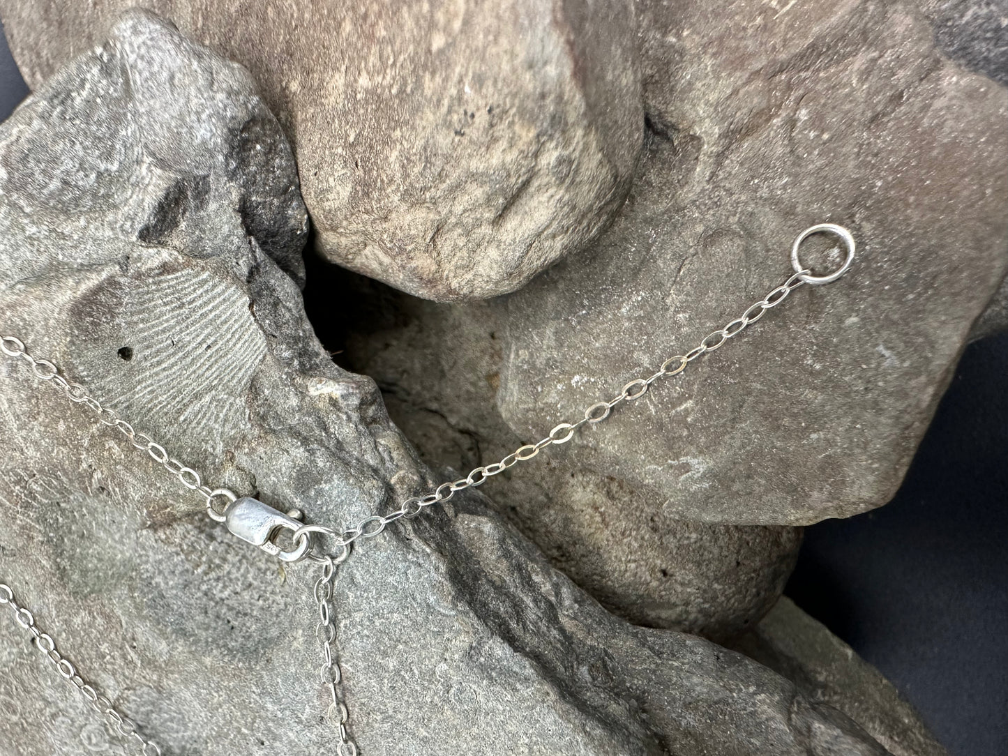 Shows the silver lobster clasp of adjustable 16 or 18 inch length of the handcrafted silver topographic necklace