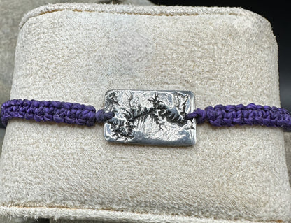A handcrafted silver bracelet showing the topographic contours of the Grand Canyon – front view knotted bracelet