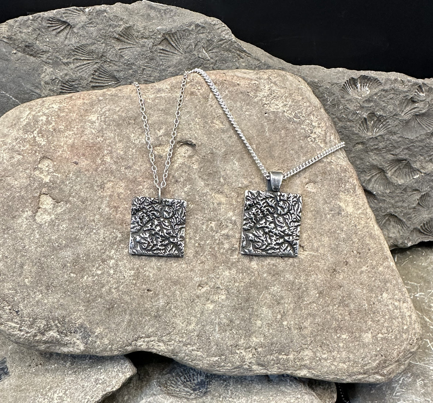 Pair of 3D fine silver pendants of North Cascades National Park.  Accurately displays the elevations and contours of the park in two different sizes.
