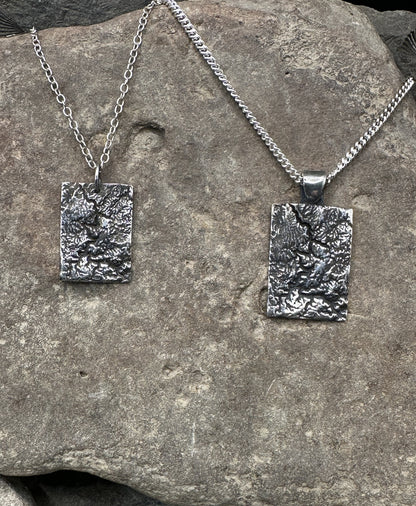 Pair of 3D fine silver pendants of New River Gorge National Park.  Accurately displays the elevations and contours of the park in two different sizes.