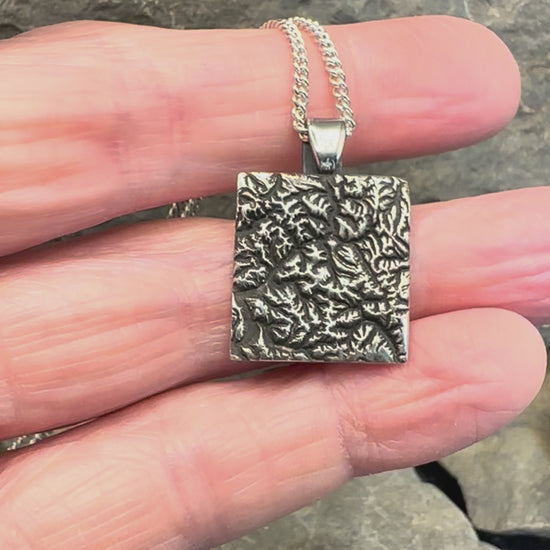 Video of 3D fine silver pendant of North Cascades National Park.  Accurately displays the elevations and contours of the park.  