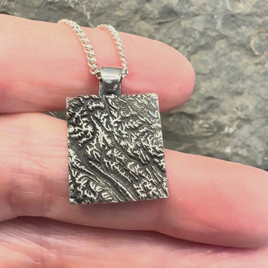 Video of 3D fine silver pendant of Alberta Canada's Banff National Park.  Accurately displays the elevations and contours of the park.  
