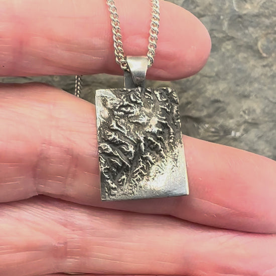 Video of 3D fine silver pendant of Kenai Fjords National Park.  Accurately displays the elevations and contours of the park.  